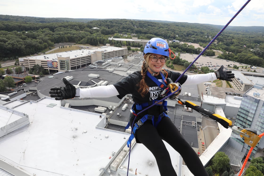 25OTE Woman from NFA poses just over the edge