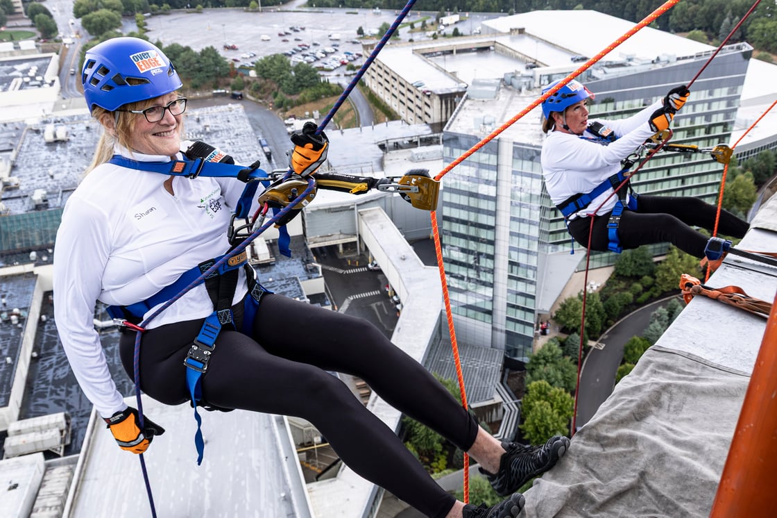 Two females rappel down the side of Mohegan Sun's Sky Tower