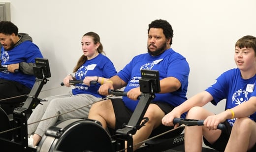 4 members of Team CT on rowing machines